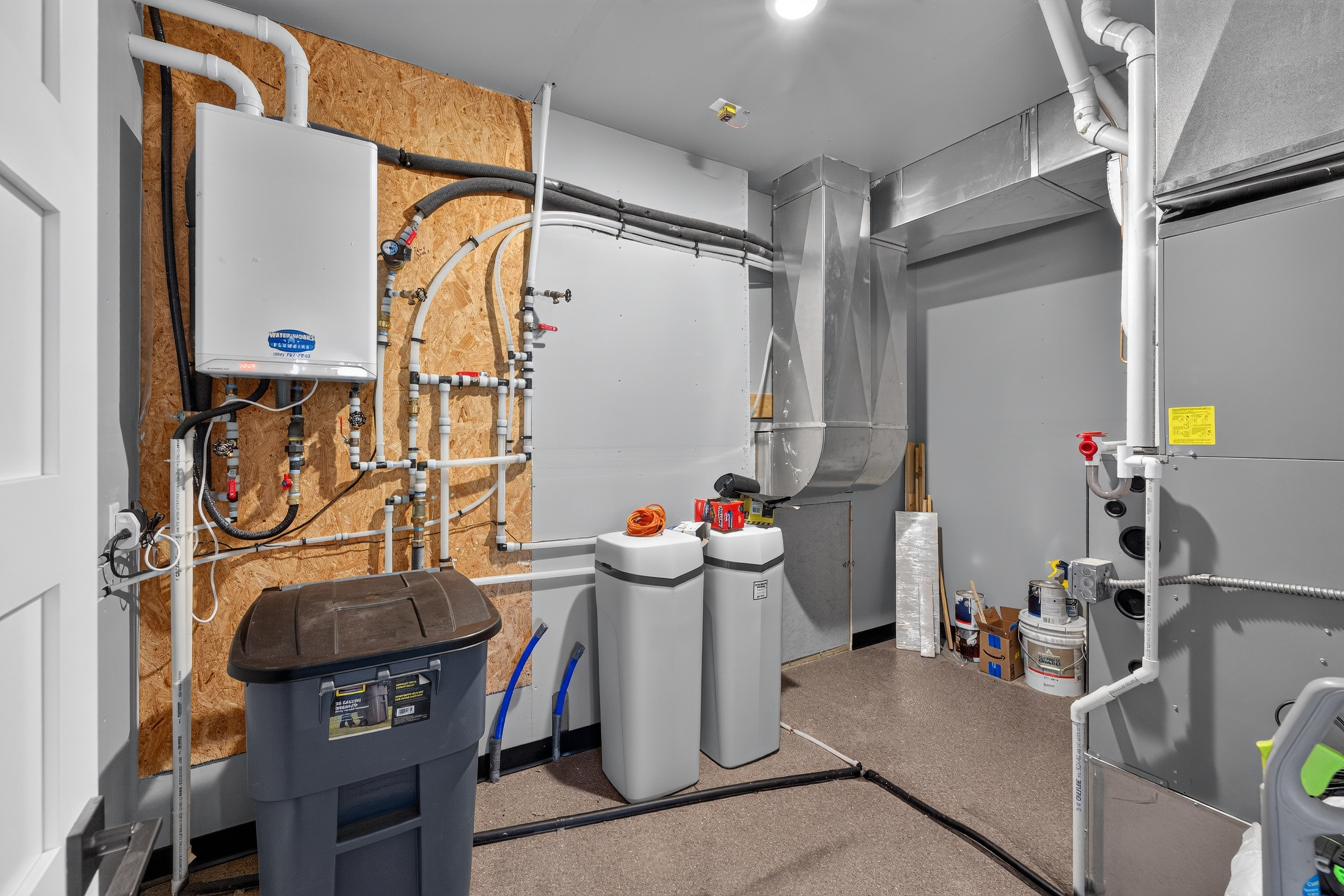 The mechanical room at 2111 Vantage Circle houses the tankless water heater